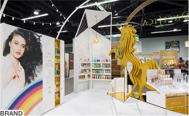 An image of Turn Pacifica trade show booth with gold unicorn